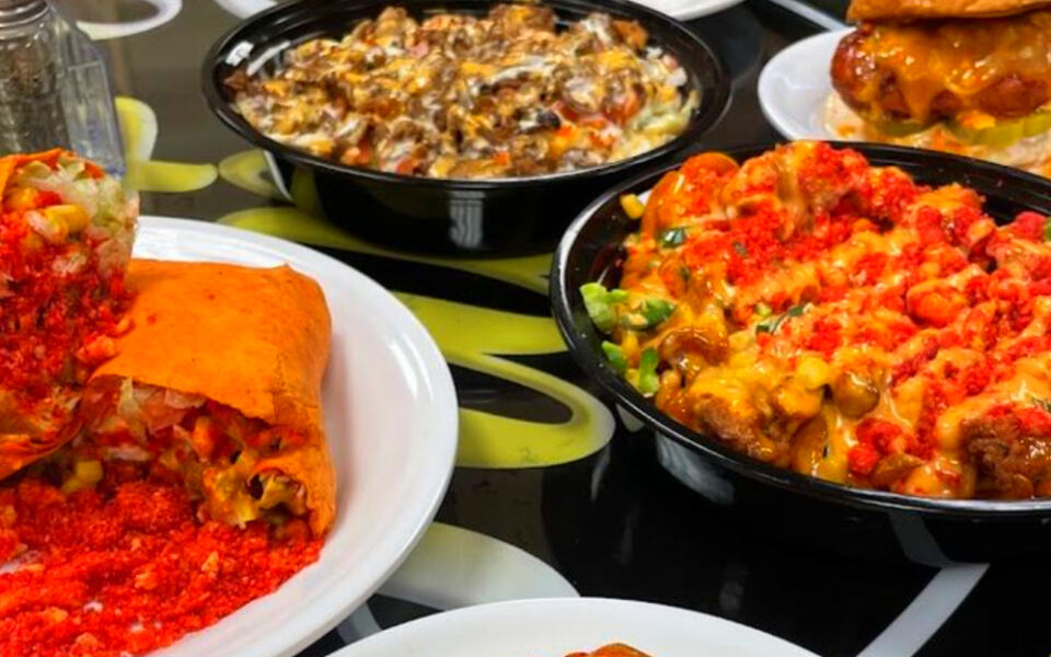 This Hidden Dearborn Spot Serves Nacho-Covered Burgers and Massive Plates Locals Swear By