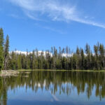 This Oregon Lake Has an Easy 11.5-Mile Trail With Two Volcanic Peaks in View