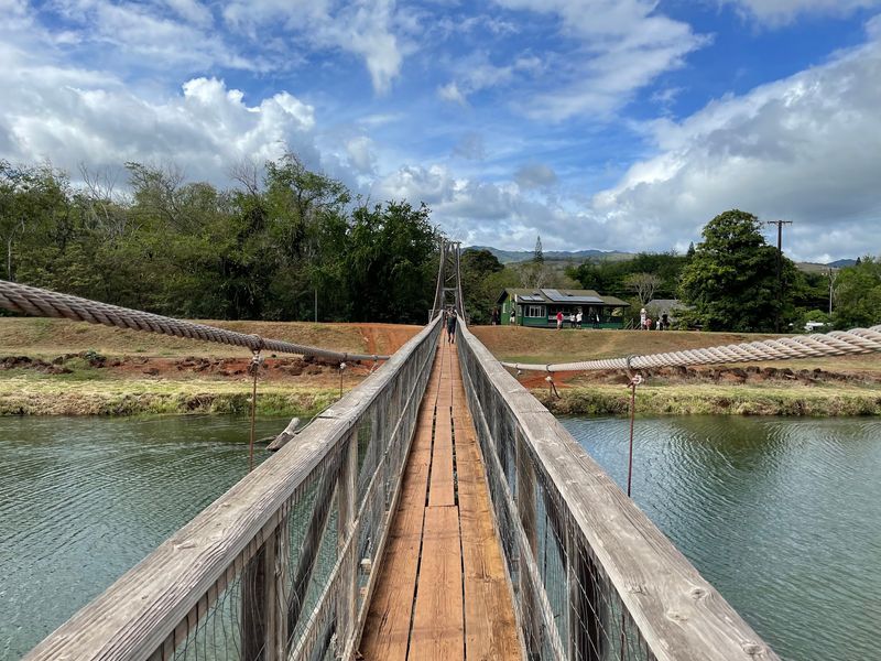 A Plank Suspended Over the River on Kauai's West Side A Plank Suspended Over the River on Kauai's West Side