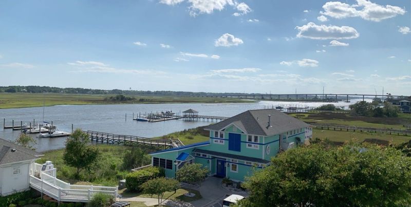 Describe the setting as waterfront, not riverside Describe the setting as waterfront, not riverside