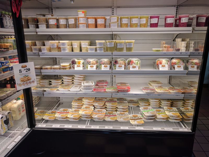 Eastern European Grocery Shelves Alongside The Food Counter