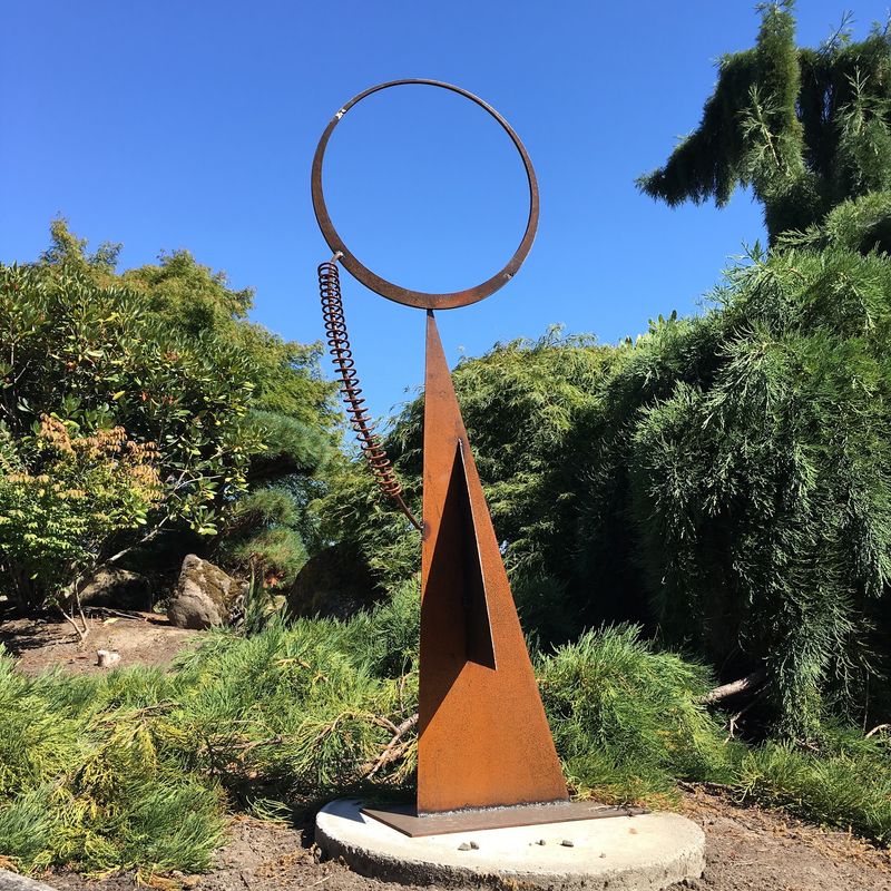 Metal Sculptures Tucked Among the Greenery