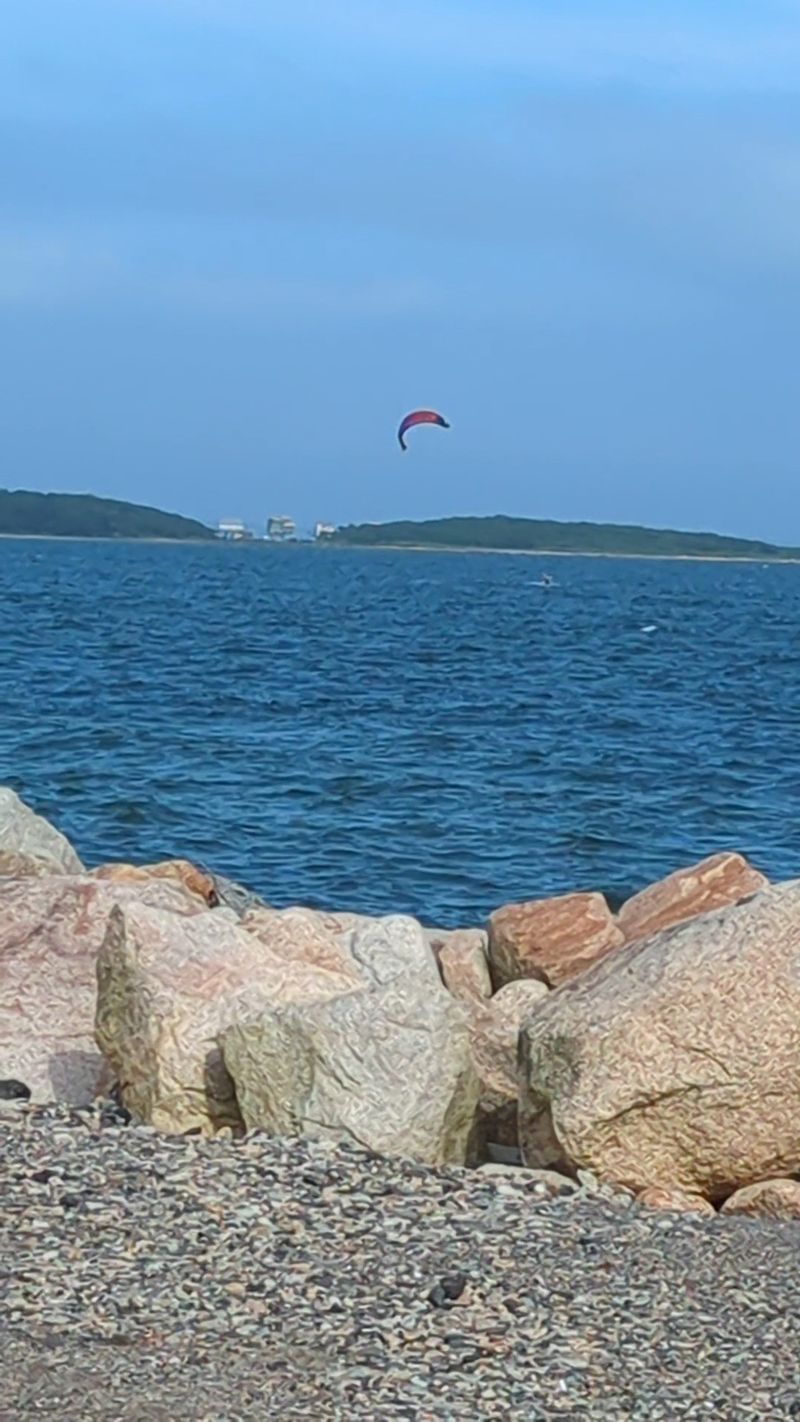 Sailboards, Fishing Lines, and a Pocket-Size Beach