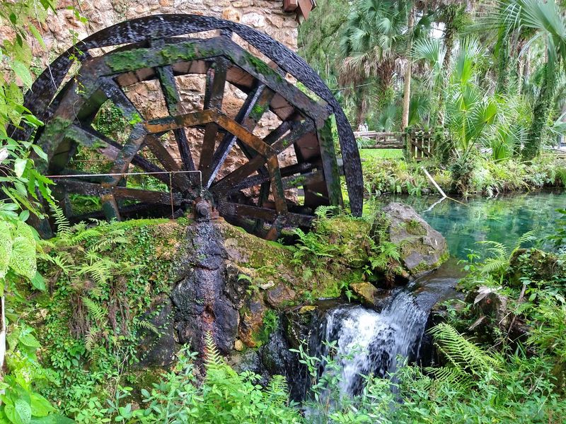 The Historic Mill House and Its Turning Water Wheel The Historic Mill House and Its Turning Water Wheel