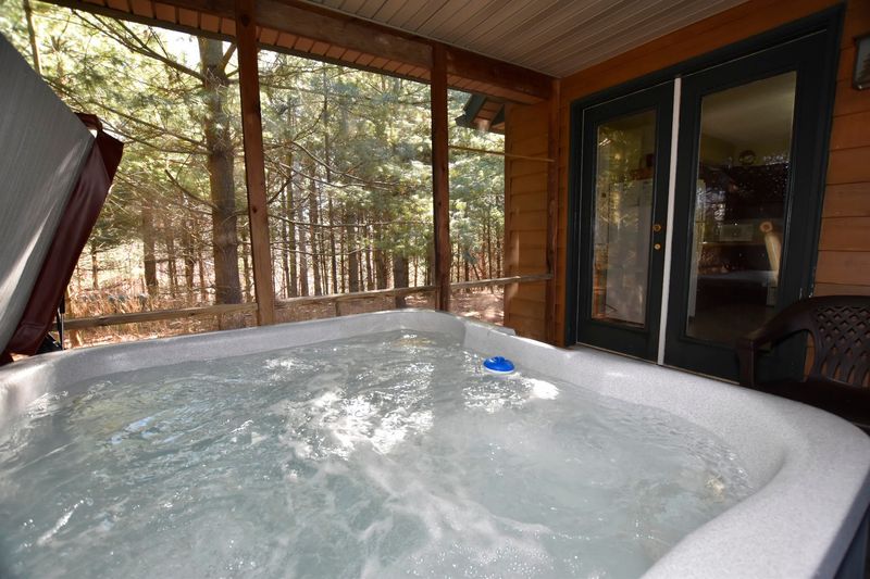 The Hot Tub Setup and the Screened Porch Experience