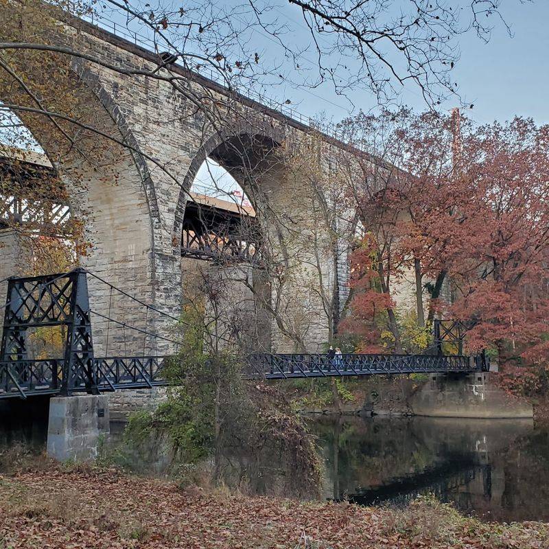 The Man-Made Waterfall and the Bridges That Frame the Creek The Man-Made Waterfall and the Bridges That Frame the Creek