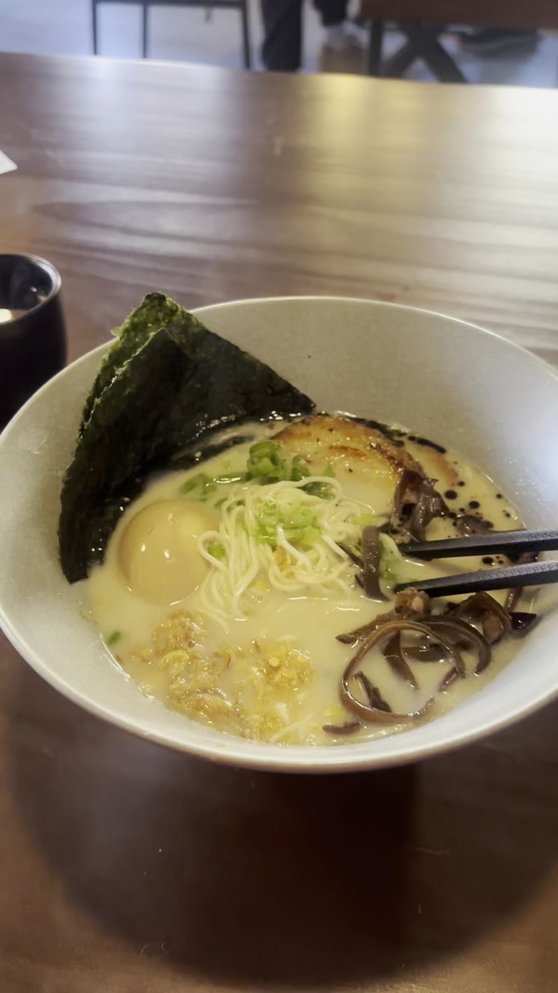 Tonkotsu supplies the bowl’s documented richness