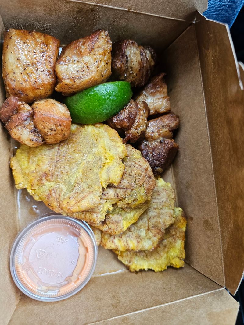 Tostones, carne frita, and the pink sauce clue