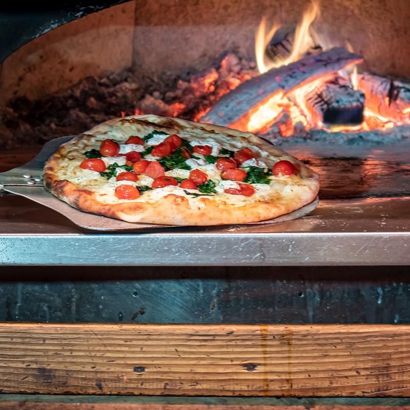 Wood-Fired Pizzas and Hearty Entrees for Every Appetite Wood-Fired Pizzas and Hearty Entrees for Every Appetite