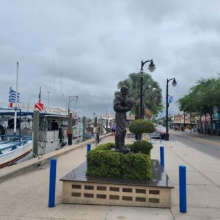 Dolphins Swim Past the Boardwalk While You Eat Fresh Seafood in Florida’s Tiny Tarpon Springs Sponge Docks