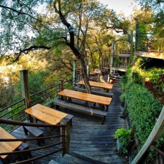 Gruene’s Grist Mill Restaurant Lets You Eat Brisket on a Deck Hanging Over the Guadalupe River