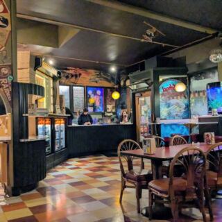 This Retro Olympia, Washington Pizza Joint Pairs Plate-Sized Thin-Crust Slices With Pinball and ’80s Posters