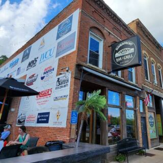 This Off-the-Beaten-Path Illinois Bar and Grill Serves Up Live Music, Cold Beers, and Views of the River Across the Street