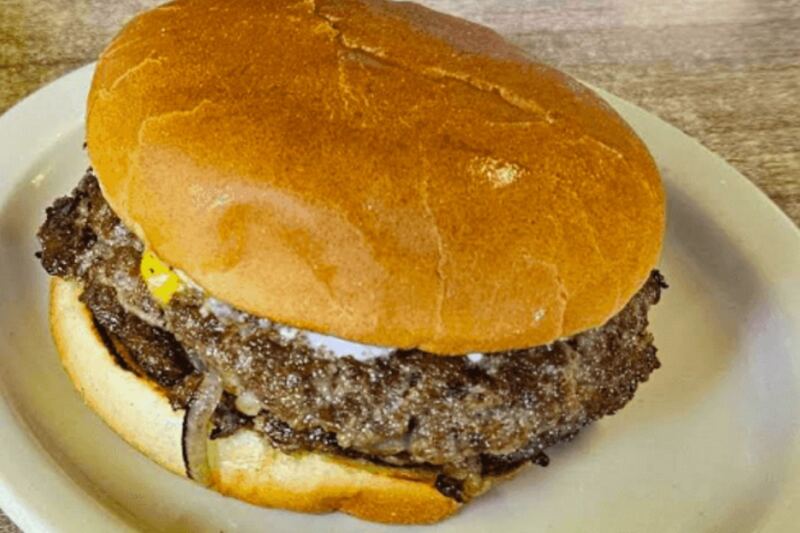 This Retro Indiana Diner Has Been Slinging Famous Onion Burgers Under A Ceiling Train For Decades