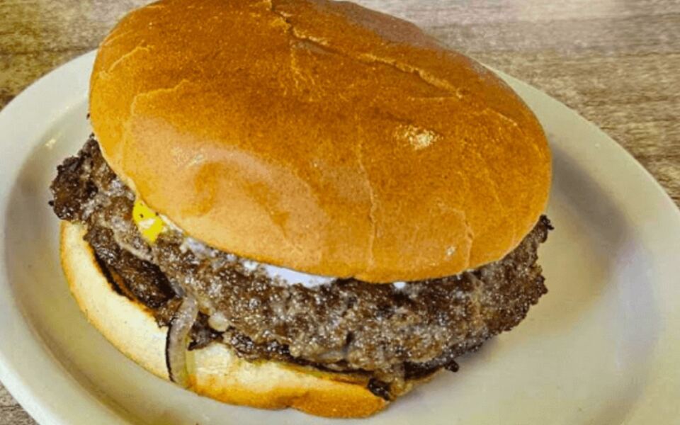 This Retro Indiana Diner Has Been Slinging Famous Onion Burgers Under A Ceiling Train For Decades