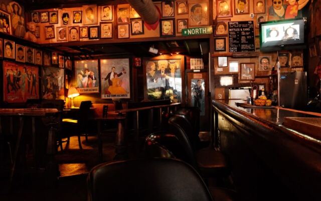 Here’s Why Regulars Still Crowd This Cash-Only Illinois Dive Bar Where the Owner’s Own Artwork Covers Every Wall