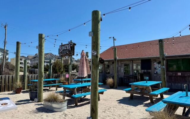 This Barefoot North Carolina Surf Bar Serves Adult Milkshakes While Surf Videos Roll Overhead