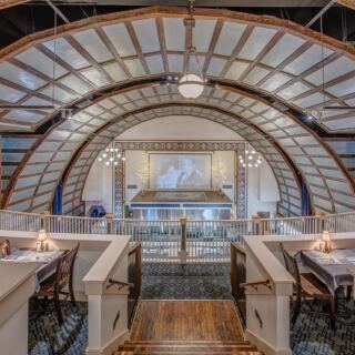 This Century-Old North Carolina Theater Now Serves Steak Beneath Its Original Stage Lights