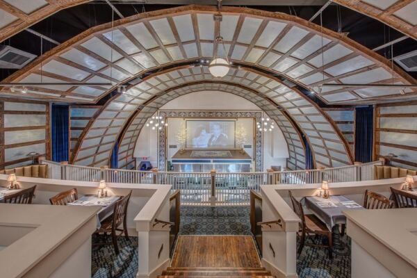This Century-Old North Carolina Theater Now Serves Steak Beneath Its Original Stage Lights