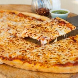 This Minnesota Pizza Shop Serves Pies Shaped Like Footballs