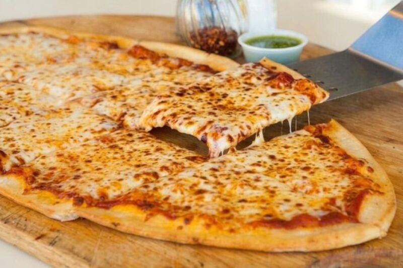 This Minnesota Pizza Shop Serves Pies Shaped Like Footballs