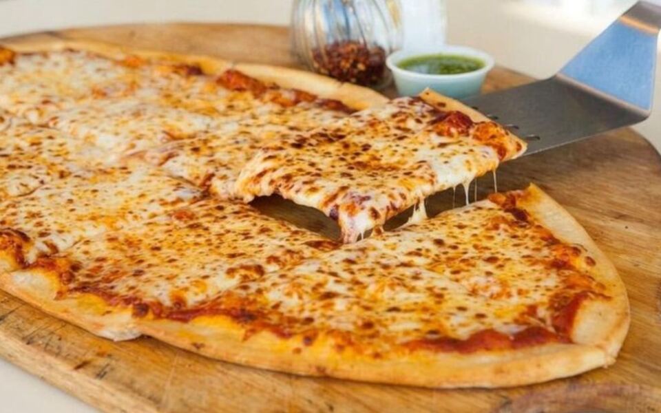 This Minnesota Pizza Shop Serves Pies Shaped Like Footballs