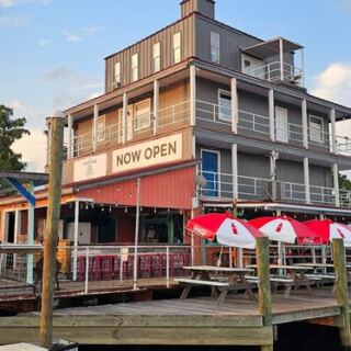 This Louisiana Riverfront Bar and Grill Serves Live Music and Waterfront Seats With a Boat Dock Out Back