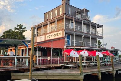 This Louisiana Riverfront Bar and Grill Serves Live Music and Waterfront Seats With a Boat Dock Out Back