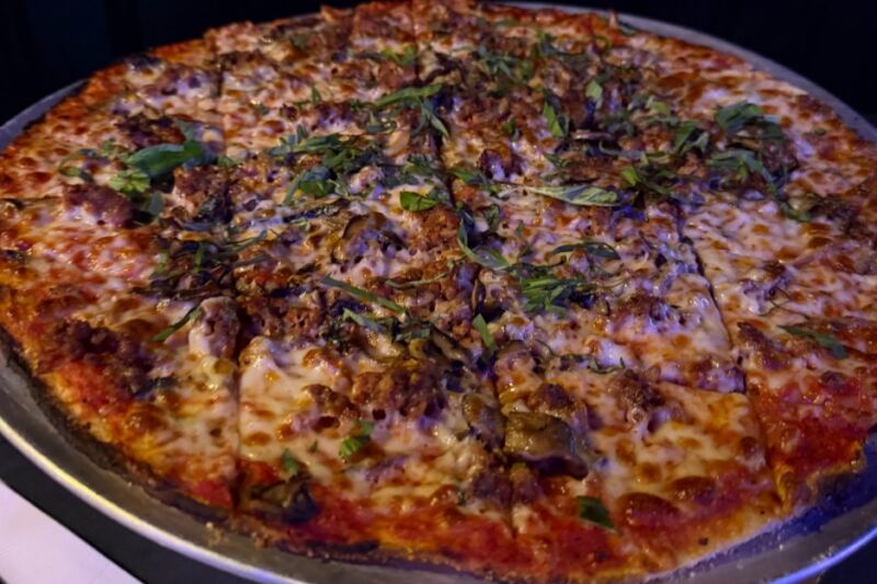This Wisconsin Speakeasy Hides in an Old Italian Workers Club and Serves Tavern-Style Pies Diners Call Madison’s Best
