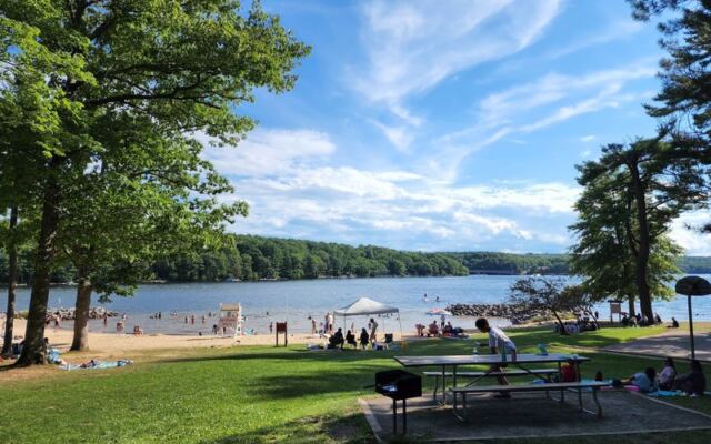 This Maryland State Park Beach Has A Sandy Lakefront Swim Area And A Playground Right Beside It