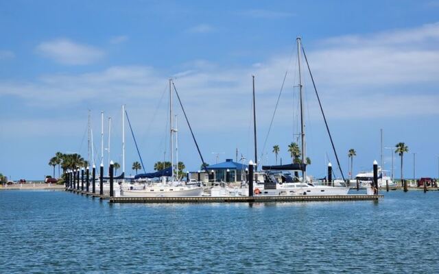 This Corpus Christi Marina Hangout Has a Floating Bar and an Upstairs Tavern Over the Bay