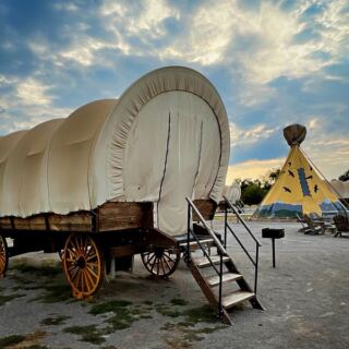 Sleep Under the Stars in an Oklahoma Covered Wagon Where the Only Neighbors Are Coyotes and Constellations