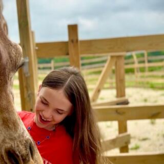 This Oklahoma Wildlife Ranch Lets You Hand-Feed Giraffes and Watch Otters Swim Right Outside Your Window