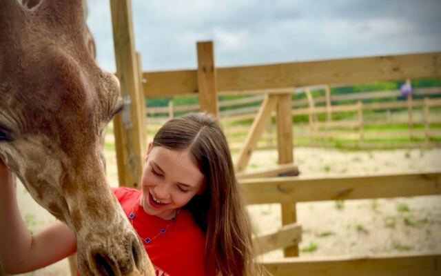 This Oklahoma Wildlife Ranch Lets You Hand-Feed Giraffes and Watch Otters Swim Right Outside Your Window