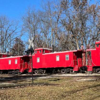 This Illinois Wildlife Park Lets You Sleep in a Caboose Near Bison, Elk, Wolves, and Other Native Animals