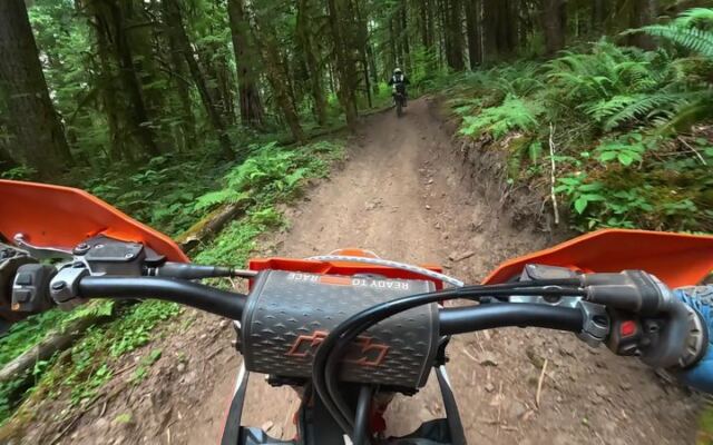 This Oregon Off-Road Park Cuts Dirt Bike And Quad Trails Through A Working Logged Forest Of Slick Red Clay