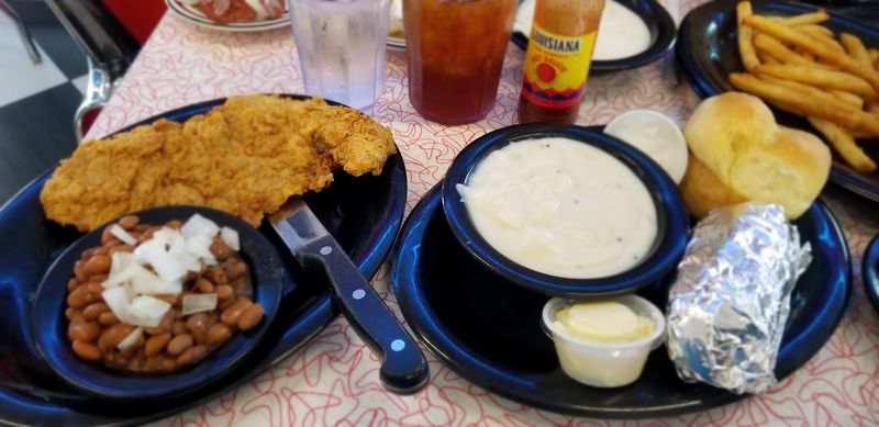 This Family-Owned Coweta, Oklahoma Catfish Joint Brings Out Hush Puppies, Pinto Beans, and Slaw Before Your Fish