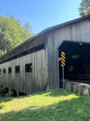 This Historic Covered Bridge Along the Mohawk Trail Hides a Waterfall Worth Pulling Over For