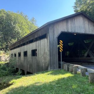 This Historic Covered Bridge Along the Mohawk Trail Hides a Waterfall Worth Pulling Over For