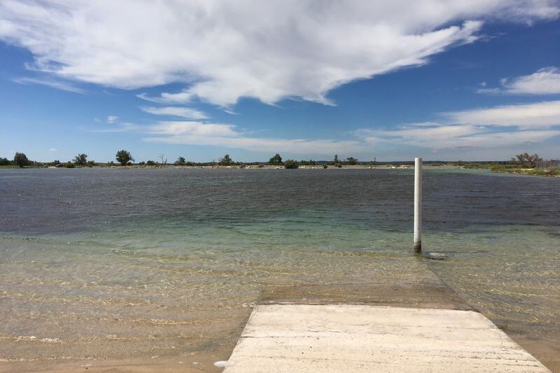 This Crystal-Clear Oklahoma Mineral Beach Hides in the Middle of Nowhere Like a Secret Oasis