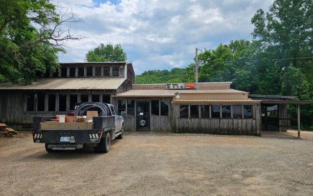 Farm Crews Have Stopped at This Tin-Roofed Shack Near Sallisaw, Oklahoma for Hickory Smoke Since the 1960s