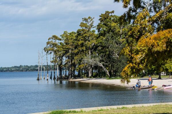 This Louisiana State Park Opens to a Sandy Lake Pontchartrain Beach Under Spanish-Moss Oaks Where Swimming and Fishing Await