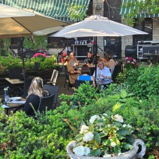 This Minnesota Restaurant Hides A Fairytale Garden Patio Behind An 1889 Building