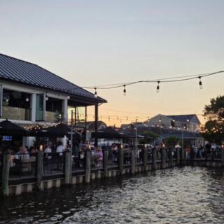 This New Jersey Waterfront Hangout Has Three Bars, Live Music, and Dockside Rocking Chairs