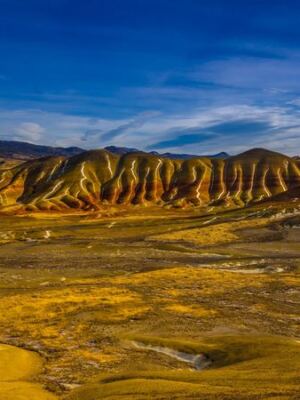 This Remote Oregon Fossil Bed Lets You Walk Among Ancient Painted Rock Layers Millions of Years Old