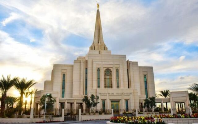 This Gilbert Arizona Temple Rises Over Desert Gardens With Pale Stone and a Gleaming Spire