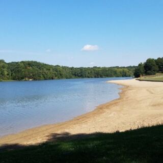 This Clean Indiana State Park Beach Has A Shallow Swim Area And Sand Or Grass To Spread Out On