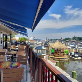 This New Jersey Riverfront Marina Bar Pairs Live Bands, Sushi, and Sunset Drinks by the Water