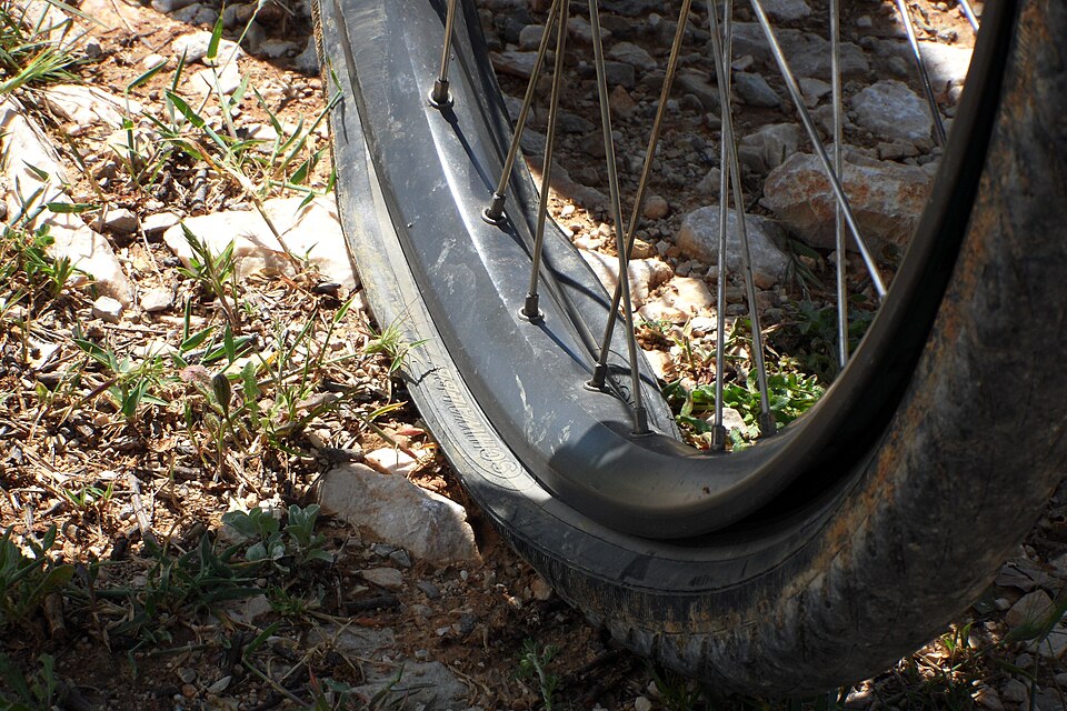 A Bicycle With a Flat Tire A Bicycle With a Flat Tire