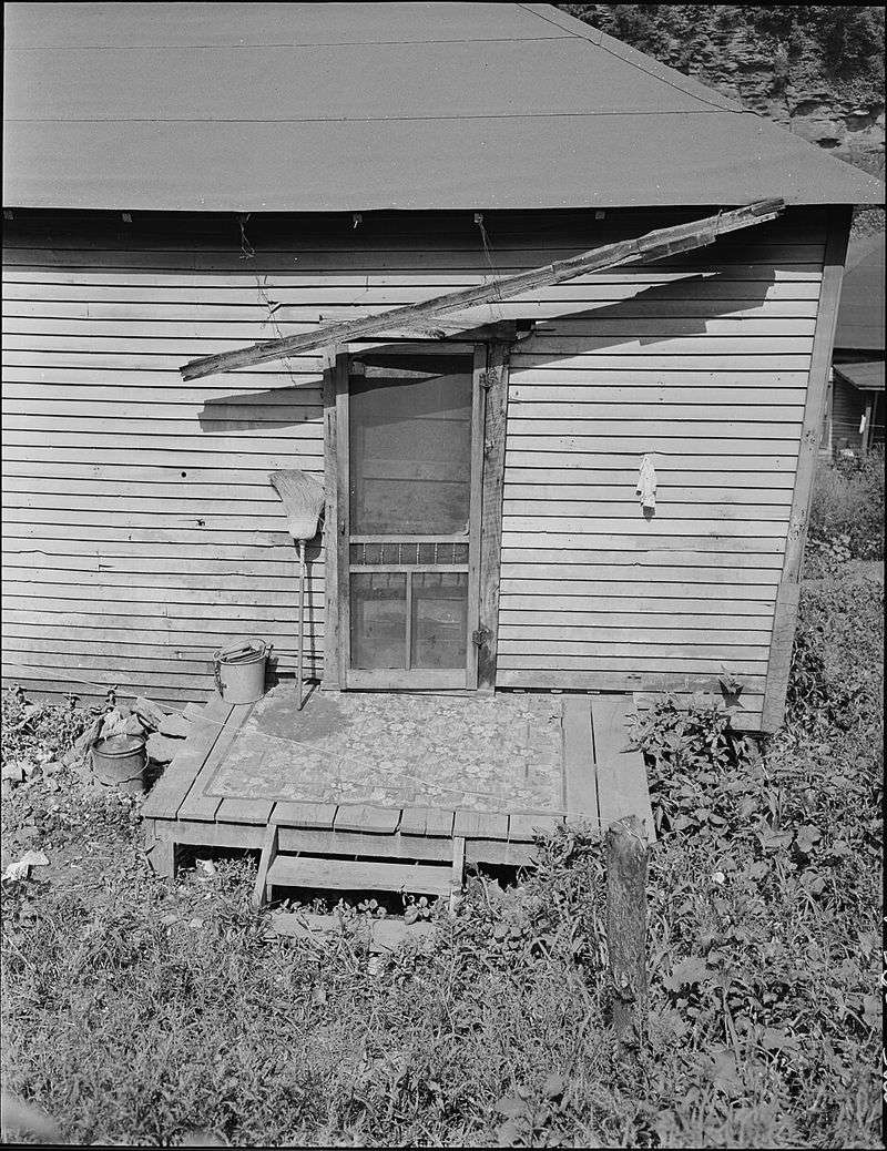 A Screen Door With a Hole in It A Screen Door With a Hole in It
